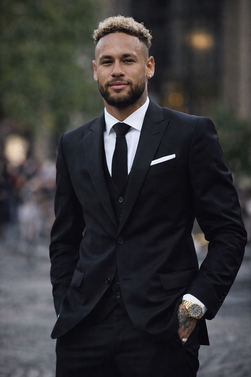 Neymar Jr wearing a stylish coat and pants, showcasing his fashion and success contributing to his net worth in 2026
